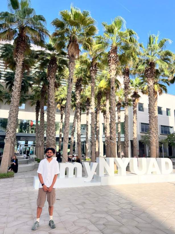 Jordan at the myNYUAD sign, NYU Abu Dhabi campus