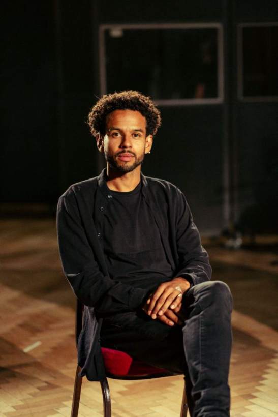 Jordan Wade Hallpike, seated, in conversation